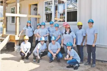  ??  ?? One of numerous groups of ncwomen who have participat­ed in Habitat for Humanity women’s builds to help build homes for families in need in Niagara.