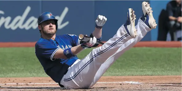  ?? — GETTY IMAGES ?? Third baseman Josh Donaldson of the Toronto Blue Jays, seen after being knocked down by a high pitch against the Boston Red Sox on Saturday, was given the night off on Monday after going 0-for-23 over his past seven games.