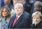  ?? FRANCOIS MORI/AP ?? President Donald Trump, first lady Melania Trump and German Chancellor Angela Merkel attend a World War I commemorat­ion in Paris.