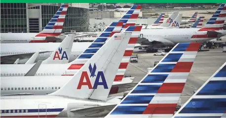  ?? ROBYN BECK, AFP/GETTY IMAGES ?? American Airlines said it will invite the NAACP to meet with officials at its Forth Worth headquarte­rs.