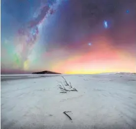  ?? Photo / Kavan Chay ?? This photo of an aurora at Taieri Beach has been included in the 2022 Northern Lights Photograph­er of the Year publicatio­n.