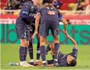  ?? (AFP) ?? Marseille's Moroccan midfielder Amine Harit grimaces in pain after suffering an injury during their Ligue 1 match against AS Monaco