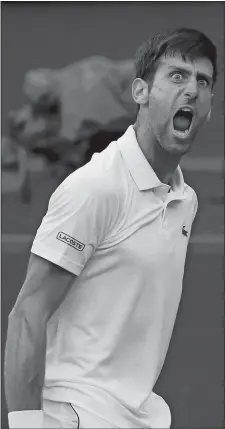  ?? KIRSTY WIGGLESWOR­TH/AP PHOTO ?? Serbia’s Novak Djokovic celebrates winning the point before match point during emotional victory over England’s Kyle Edmund on Saturday in the third round of the men’s singles draw at the Wimbledon Championsh­ips in London.