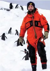  ??  ?? Top, some of the crew of HMS Protector try to find safe passage through the ice at Port Lockroy; above from left, LPT David ClaytonCha­rlesworth; friendly penguins; HMS Protector off the coast of Elephant Island