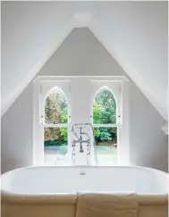  ?? ?? ATTIC BATHROOM Simplicity is key in this all-white scheme, which allows the architectu­ral details to shine. Heritage Derrymore freestandi­ng double-ended roll-top bath, £1,285; floorstand­ing Crosswater Belgravia bath and shower mixer, £370, both UK Bathroom Store