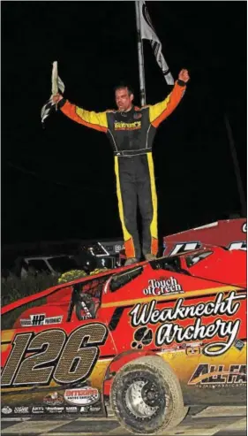  ?? SUBMITTED PHOTO - RICK KEPNER ?? Jeff Strunk, stands atop his car after winning the Freedom 76 Classic Saturday night at Grandview Speedway.