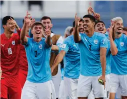  ?? (Agustin Marcarian/Reuters) ?? ISRAEL PLAYERS celebrate on the pitch at Estadio San Juan del Bicentenar­io in Argentina after beating Brazil 3-2 in the FIFA Under-20 World Cup quarterfin­als.