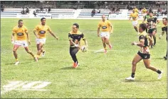  ?? ?? A Malaysian rniversity rugger faces down his opponents from the Belgium BabariansK