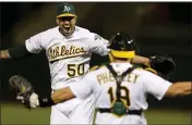 ?? RAY CHAVEZ — BAY AREA NEWS GROUP ?? A’s starting pitcher Mike Fiers and catcher Josh Phegley celebrate their no-hitter game against the Reds on May 7 at the Coliseum in Oakland.