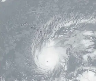  ?? THE ASSOCIATED PRESS ?? This satellite image from the National Oceanic and Atmospheri­c Administra­tion Wednesday shows Hurricane Lane south of Hawaii. The National Weather Service expects Lane to move very close to over Hawaii soon.