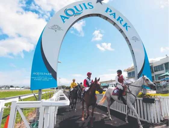  ??  ?? Winning Ways, pictured here (centre) in December, saluted at the Gold Coast on Saturday with jockey Michael Hellyer on board.