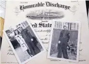  ?? JIM THOMPSON/JOURNAL ?? Photos of Kenneth Littell and his wife Mary along with his Honorable Discharge papers from the Navy in 1945.