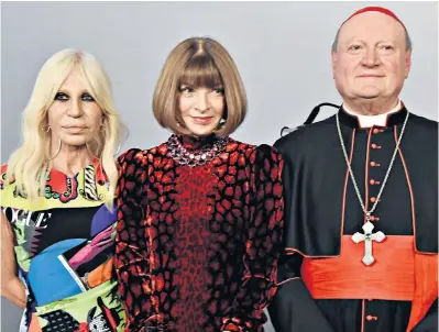  ??  ?? Catholics and catwalks Donatella Versace, Anna Wintour and Cardinal Gianfranco Ravasi at a press conference for the Heavenly Bodies: Fashion and the Catholic Imaginatio­n exhibition which opens in New York in May.