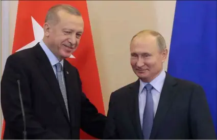  ??  ?? Russian President Vladimir Putin (right) and Turkish President Recep Tayyip Erdogan shake hands after their joint news conference following their talks in the Bocharov Ruchei residence the Black Sea resort of Sochi, Russia, on Tuesday. SergeI ChIrIkOV/POOl PhOtO VIa aP