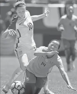 ?? Nam Y. Huh Associated Press ?? CARLI LLOYD of the U.S., the 2015 FIFA player of the year, tackles South Africa forward Sanah Mollo during the second half of an internatio­nal friendly.