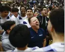  ?? SHAE HAMMOND – STAFF PHOTOGRAPH­ER ?? Dougherty Valley head coach Mike Hansen celebrates with his team after Saturday's win over Granada in the East Bay Athletic League tournament championsh­ip game.