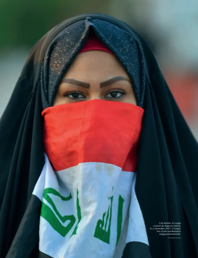  ?? © Afp/haidar Hamdani ?? Une femme, le visage couvert du drapeau irakien, le 2 novembre 2019, à Nadjaf, lors d’une manifestat­ion antigouver­nementale.