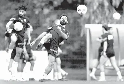  ?? — Gambar AFP ?? CEDERA: Mohd Salah menyertai sesi latihan di Stadium Jardin Botanique menjelang perlawanan Piala Negara Afrika 2024 pada 17 Januari lalu.