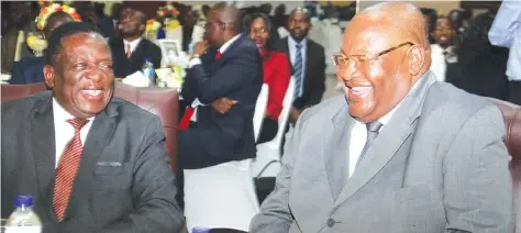  ?? Picture by Kudakwashe Hunda ?? ZANU-PF Second Secretary and Acting President Emmerson Mnangagwa and Secretary for Finance Obert Mpofu (right) share a lighter moment at the revolution­ary party’s National Fundraisin­g Business Breakfast meeting in Harare yesterday.