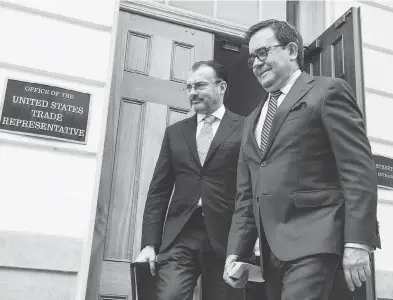  ?? ERIC BARADAT / AFP / GETTY IMAGES ?? Mexican Foreign Minister Luis Videgaray, left, and Economy Minister Ildefonso Guajardo leave the Office of the U.S. Trade Representa­tive in Washington on Wednesday after a day of meetings on the NAFTA treaty.