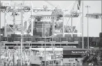  ?? WILFREDO LEE AP FILE ?? Containers of imported goods are stacked near cranes at PortMiami. The U.S. trade deficit hit a near-record high.
