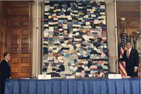  ?? MARINA VILLENEUVE ?? New York Governor Andrew Cuomo, right, displays some of the hundreds of masks sent to New York from individual­s who want to help beleaguere­d front-line workers at a news conference at the State Capitol in Albany, N.Y., Wednesday, April 29, 2020. At left is Dr. Howard A, Zucker, Commission­er of Health for New York State.