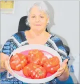  ??  ?? Glenda Job with four of her whopper tomatoes.
