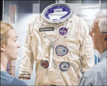  ?? John Minchillo The Associated Press ?? The spacesuit worn by Neil Armstrong on his Gemini VIII mission is among the artifacts on display at the Armstrong Air & Space Museum in Wapakoneta, Ohio.