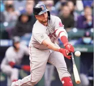  ?? Elaine Thompson / Associated Press ?? The Boston Red Sox’s Christian Vazquez doubles in a pair of runs against the Seattle Mariners in the 10th inning on Wednesday.