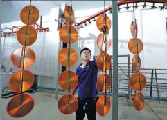 ?? CHAIWAT SUBPRASOM / REUTERS ?? An employee arranges blades for circular saws at an assembly line at Gang Yan Diamond Tools, a Chinese manufactur­ing plant, located in the Thai-Chinese Rayong Industrial Zone in Rayong, southeast of Bangkok.
