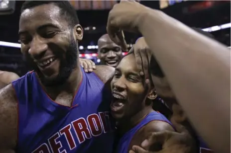  ?? ERIC GAY/THE ASSOCIATED PRESS ?? Pistons’ Brandon Jennings, center, celebrates with Andre Drummond, left, after scoring improbable, game-winning basket Tuesday against the Spurs.