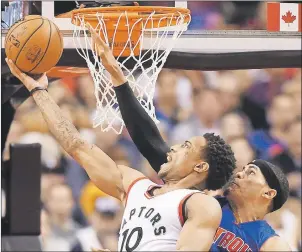  ?? 5)& $"/"%*"/ 13&44 '3"/, (6// ?? Toronto Raptors guard DeMar DeRozan (10) drives to the hoop against Detroit Pistons forward Tobias Harris (34) during second half NBA basketball action in Toronto on Sunday.