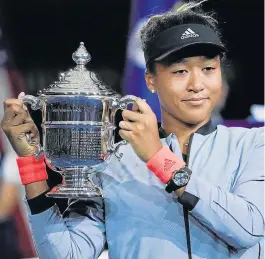  ?? Picture: USA TODAY/Robert Deutsch ?? HUMBLE VICTORY: Japan’s Naomi Osaka holds the US Open trophy after beating Serena Williams of the US in the women’s final at the Billie Jean King National Tennis Centre, in Flushing Meadows.