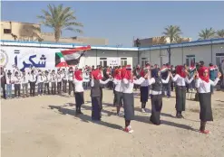  ??  ?? A scene from the opening ceremony of a Kuwaiti-funded school in Al-Ramadi.