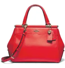  ?? COACH ?? The Selena Grace bag in Selena Red.