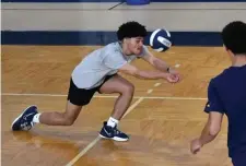 ?? CHRiS CHRiSTo / HeRald STaFF ?? CAN YOU DIG IT? Julio Santana digs a shot during Lawrence volleyball practice earlier this week.