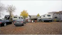  ?? LUIS SÁNCHEZ SATURNO/THE NEW MEXICAN ?? RVs are parked Wednesday at Piñon RV Park on Los Pinos Road. Denise Carro, the park’s property manager, says she’s seen several residents come through who are waiting to rent or buy a home.