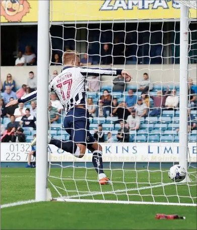  ??  ?? WRONG WAY: Millwall's Byron Webster scores an own goal