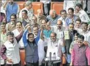  ?? AP ?? Karnataka CM HD Kumaraswam­y, state minister DK Shivakumar, Deputy CM G Parameshwa­ra and others celebrate after presenting the 2019-20 budget at Vidhan Soudha, Bengaluru, on Friday.