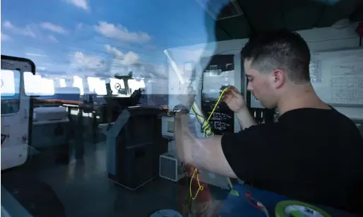  ??  ?? Leading Seaman Dan Cramer practises traditiona­l rope work aboard Yellowknif­e.
