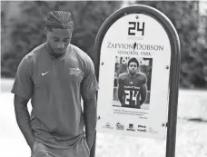  ?? SAUL YOUNG/ NEWS SENTINEL ?? Former Middle Tennessee State football player Zack Dobson stops at the park named in honor of his brother, Zaevion Dobson, on March 25 in Knoxville, Tenn.