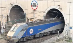  ?? Picture: PA. ?? A train leaves the Channel Tunnel at Coquelles in France.