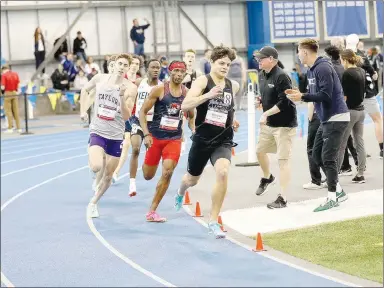  ?? Photos courtesy of JBU Sports Informatio­n ?? John Brown University’s Matthew Cook (top photo) runs the 800 meters during the NAIA National Indoor Track & Field Championsh­ips inside the SanfordJac­krabbit Athletic Complex on March 3, 2023, in Brookings, S.D. (Left photo) John Brown University athletes Johnny Dunfee, Cook, Benny Merte, Jadin Whiting, Drew Birnbaum, Drew Janzen and Chase Schermer pose for a photo.