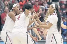  ?? JEFF CHIU — THE ASSOCIATED PRESS ?? Stanford guard Dijonai Carrington, right, celebrates with teammates after scoring against Florida Gulf Coast during the second half of a second-round game in the NCAA