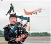  ??  ?? Above: A piper marked the first Hainan Airlines direct flight to Edinburgh last June