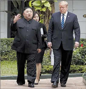  ?? AP/EVAN VUCCI ?? President Donald Trump and North Korean leader Kim Jong Un take a walk Thursday after one of their meetings in Hanoi, Vietnam.