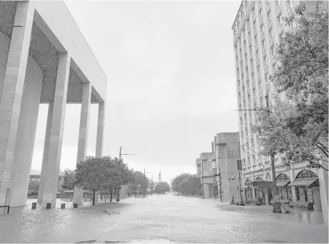  ?? Houston Chronicle ?? The Lancaster Hotel, at right, took on water during Hurricane Harvey.