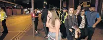  ??  ?? SHOCKING EXPERIENCE: Concert-goers react after fleeing the Manchester Arena northern England after the bomb blast in