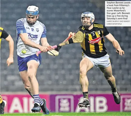  ?? HARRY MURPHY AND RAMSEY CARDY/SPORTSFILE ?? Stephen Bennett avoids a hook from Kilkenny’s Huw Lawlor as he scores Waterford’s first goal. Left: Bennett lines up a free during Saturday’s semi-final