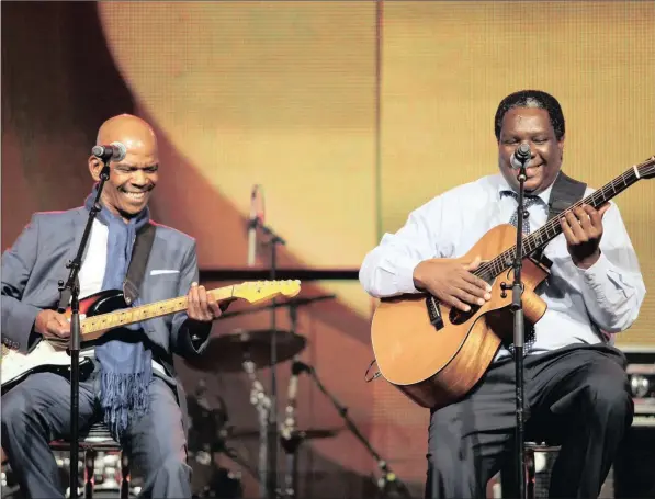  ?? PICTURE: CATHY PINNOCK ?? ENRICHING THE MUSICAL LANDSCAPE: Ray Phiri, left, and Vusi Mahlasela perform after winning the Lifetime Achievemen­t Award during the SA Music Awards ceremony in 2012.